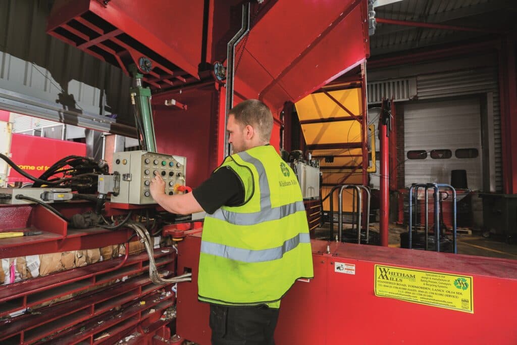 WM Automation service engineer maintaining installed handling equipment